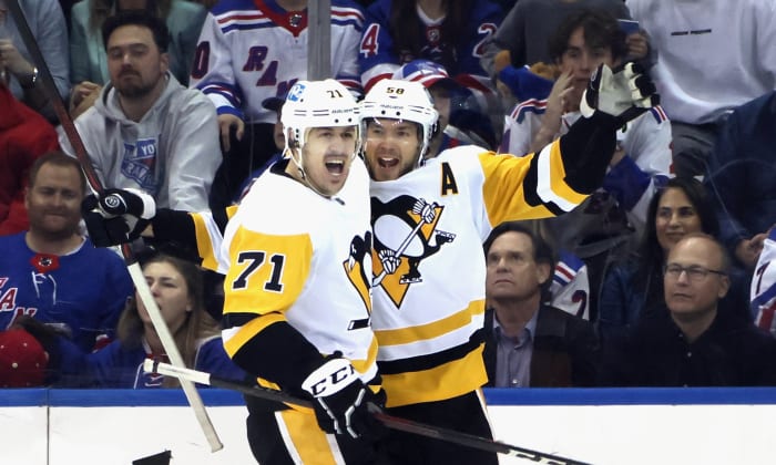 NEW YORK, NEW YORK - MAY 11: Kris Letang #58 of the Pittsburgh Penguins (R) celebrates his second period goal against the New York Rangers and is joined by Evgeni Malkin #71 (L) in Game Five of the First Round of the 2022 Stanley Cup Playoffs at Madison Square Garden on May 11, 2022 in New York City. (Photo by Bruce Bennett/Getty Images)