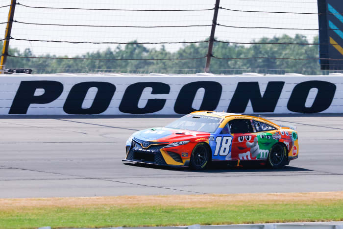 LONG POND, PA - JULY 24: Kyle Busch (#18 Joe Gibbs Racing M&M's Toyota) drives during the NASCAR Cup Series M&MS Fan Appreciation 400 on July 24, 2022 at Pocono Raceway in Long Pond, Pennsylvania. (Photo by Rich Graessle/Icon Sportswire via Getty Images)