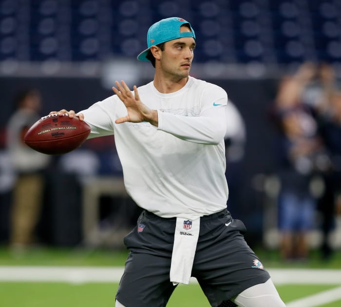 HOUSTON, TX - OCTOBER 25: Brock Osweiler #8 of the Miami Dolphins warms up before a football game against the Houston Texans at NRG Stadium on October 25, 2018 in Houston, Texas. (Photo by Bob Levey/Getty Images)