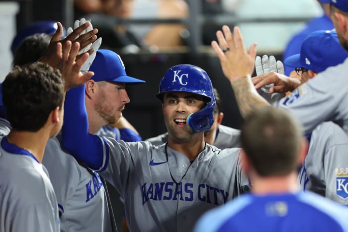 CHICAGO, Illinois - AUGUST 01: Wight Merrifield #15 of the Kansas City Royals high five team after hitting a single home run during the sixth inning against the Chicago White Sox at Guaranteed Rate Field on August 01, 2022 in Chicago, Illinois.  (Photo by Michael Reeves/Getty Images)