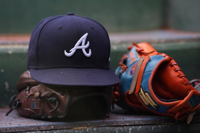 PHILADELPHIA, PA - JULY 26: A general view of gloves and an Atlanta Braves hat against the Philadelphia Phillies at Citizens Bank Park on July 26, 2022 in Philadelphia, Pennsylvania.  The Braves defeated the Phillies 6-3.  (Photo by Mitchell Leff/Getty Images)