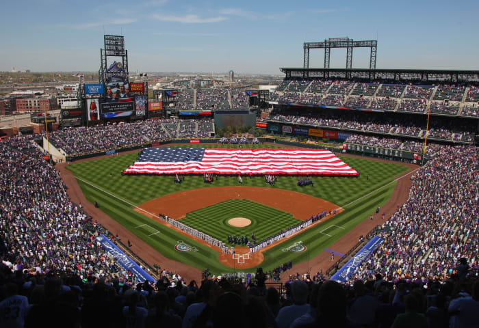 DENVER, CO - APRIL 09: The American Flag is displayed on the field as the national anthem is observed prior to the game between the San Francisco Giants and the Colorado Rockies on Opening Day at Coors Field on April 9, 2012 in Denver, Colorado. (Photo by Doug Pensinger/Getty Images)