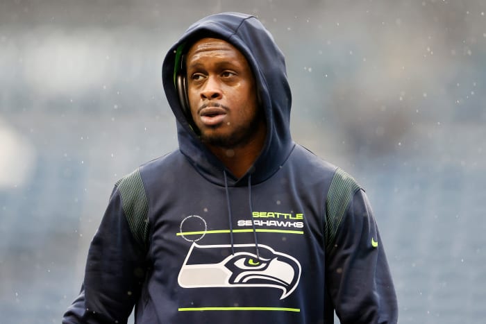 SEATTLE, WASHINGTON - JANUARY 02: Geno Smith #7 of the Seattle Seahawks looks on before the game against the Detroit Lions at Lumen Field on January 02, 2022 in Seattle, Washington.  (Photo by Steph Chambers/Getty Images)