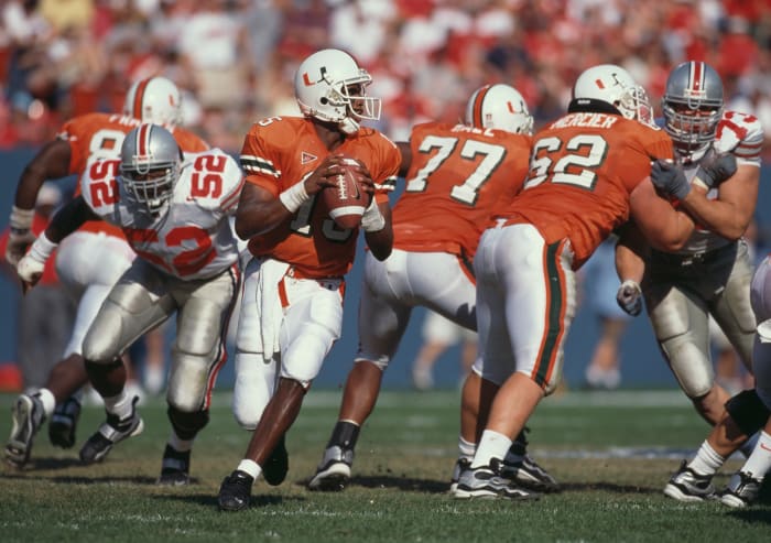 Kenny Kelly #15, Quarterback for the University of Miami Hurricanes in motion during the NCAA Kickoff Classic college football game against the Ohio State Buckeyes on 29th August 1999 at the Giants Stadium in East Rutherford, New Jersey, United States. The Miami Hurricanes won the game 23 - 12. (Photo by Jamie Squire/Getty Images)