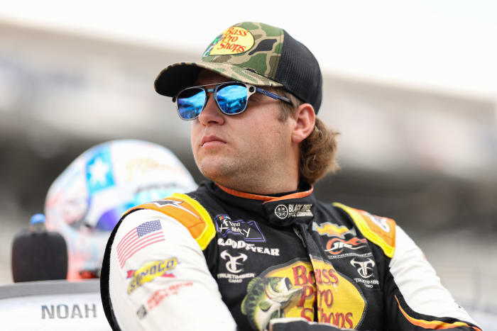 NASCAR driver Noah Gragson looks onto the track before a race.