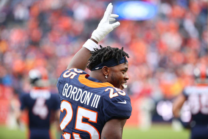 DENVER, COLORADO - JANUARY 08: Melvin Gordon #25 of the Denver Broncos gestures prior to facing the Kansas City Chiefs at Empower Field At Mile High on January 08, 2022 in Denver, Colorado.  (Photo by Jamie Schwaberow/Getty Images)