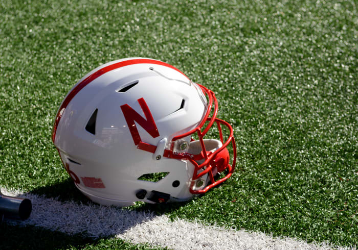 A Nebraska Cornhuskers helmet rests on the field during a 52-17 win over the Wyoming Cowboys.