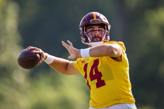 ASHBURN, VA - AUGUST 10: Sam Howell #14 of the Washington Commanders attempts a pass during training camp at INOVA Sports Performance Center on August 10, 2022 in Ashburn, Virginia.  (Photo by Scott Taetsch/Getty Images)