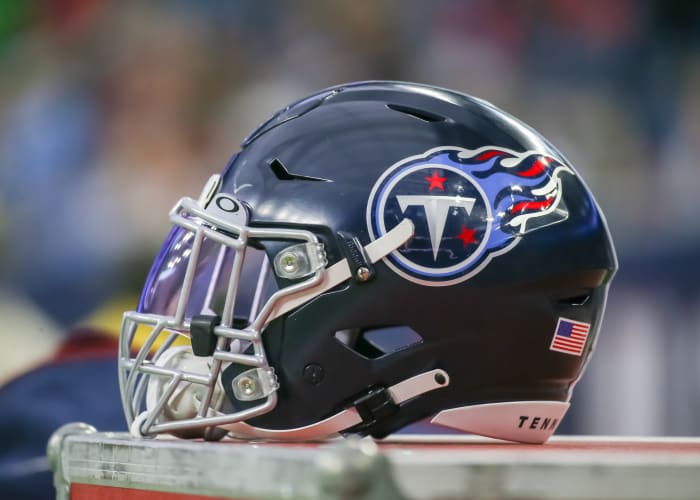 Tennessee Titans helmet rests on equipment trunk.