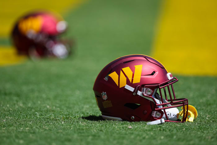 A general shot of a Washington Commanders helmet on the football field.