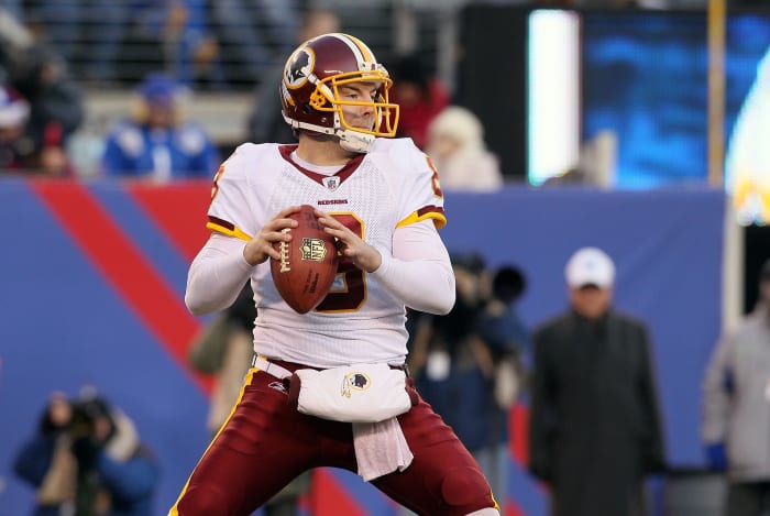 Rex Grossman drops back to pass for Washington.