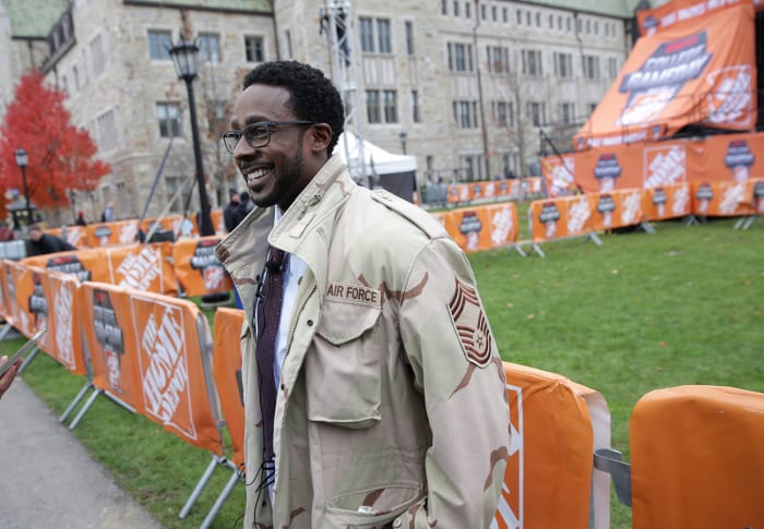 ESPN "college game day" Co-host Desmond Howard is filmed on the campus of Boston University
