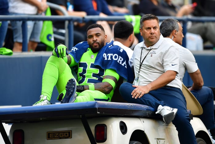 SEATTLE, WASHINGTON - SEPTEMBER 12: Jamal Adams #33 of the Seattle Seahawks is carted off the field during the second quarter against the Denver Broncos at Lumen Field on September 12, 2022 in Seattle, Washington. (Photo by Jane Gershovich/Getty Images)