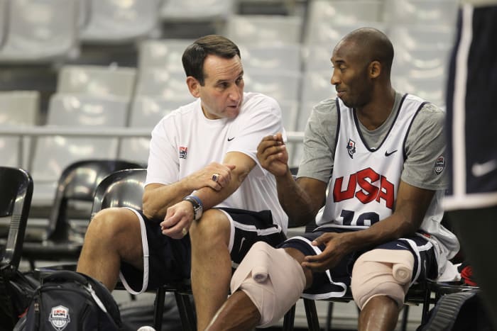 Mike Krzyzewski sitting down with Kobe Bryant at practice.