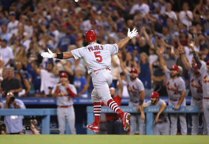 Albert Pujols celebrates his 700th home run.