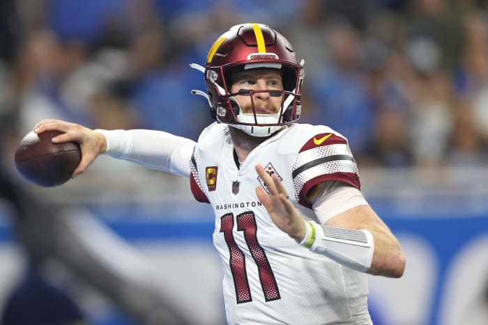Washington Commanders quarterback Carson Wentz looks to pass during the second half.