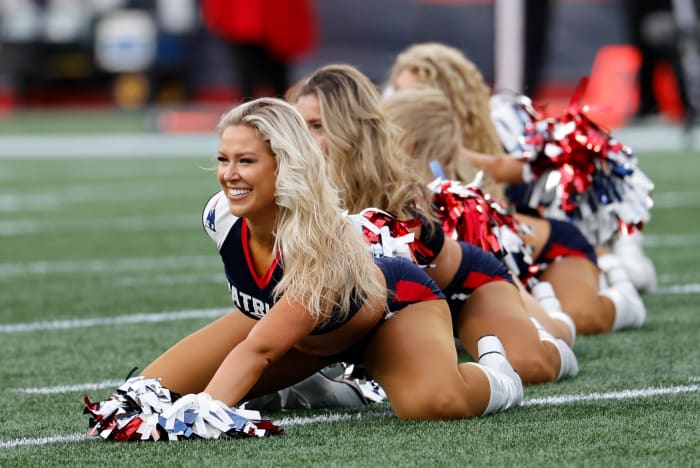 Patriots cheerleaders on the field during a preseason game.