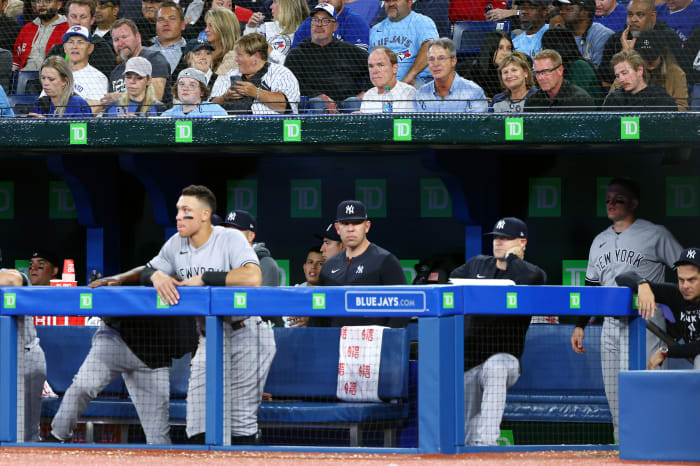 TORONTO, ON - SEPTEMBER 26: Roger Maris Jr. (4th R, first row) talks with with Patty Judge (3rd R, first row), the mother of New York Yankees slugger Aaron Judge during a game between the Yankees and the Toronto Blue Jays in the ninth inning at Rogers Centre on September 26, 2022 in Toronto, Ontario, Canada. (Photo by Vaughn Ridley/Getty Images)