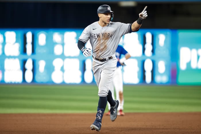Aaron Judge hits his 61st home run of the season.