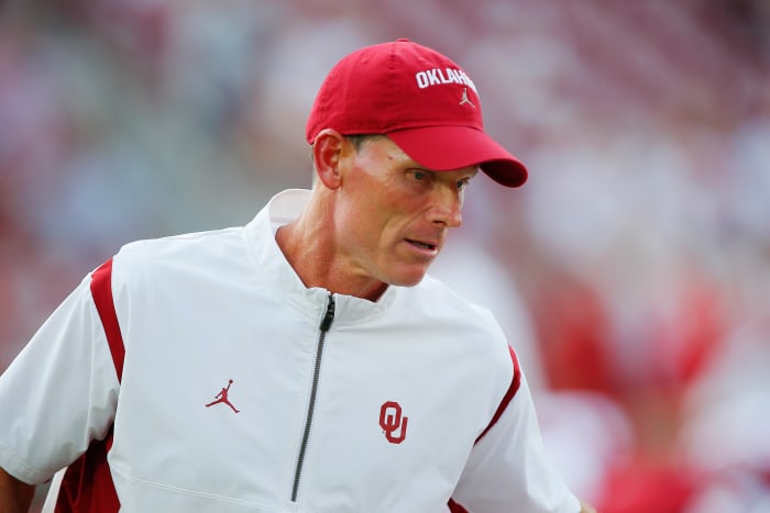 Brent Venables of the Oklahoma Sooners looks on.