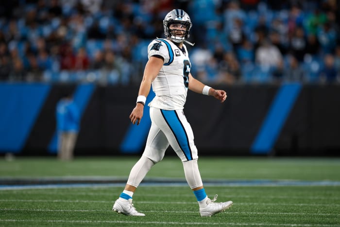 Panthers quarterback Baker Mayfield walks off the field on Sunday.