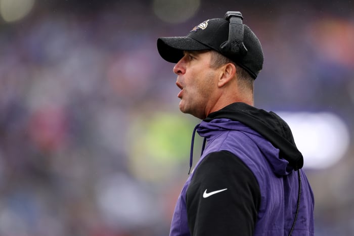 Ravens head coach John Harbaugh on the field against the Bills.