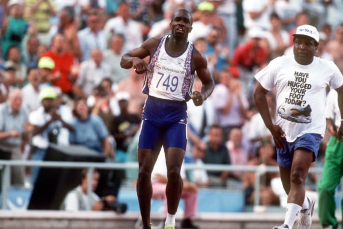 Derek Redmond limping on the track.