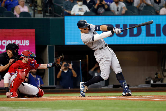 ARLINGTON, TX - OCTOBER 4:
Aaron Judge #99 of the New York Yankees hits his 62nd home run of the season against the Texas Rangers during the first inning in game two of a double header at Globe Life Field on October 4, 2022 in Arlington, Texas. Judge has now set the American League record for home runs in a single season. (Photo by Ron Jenkins/Getty Images)