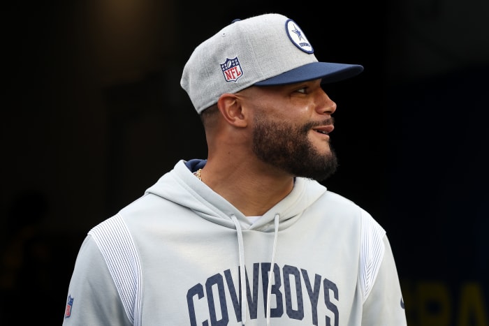 Cowboys quarterback Dak Prescott walks onto the field against the Rams.