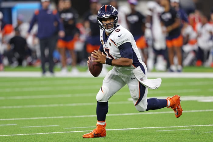 Russell Wilson rolling out of the pocket.