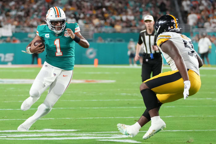 Tua Tagovailoa runs as a ball carrier against the Steelers.