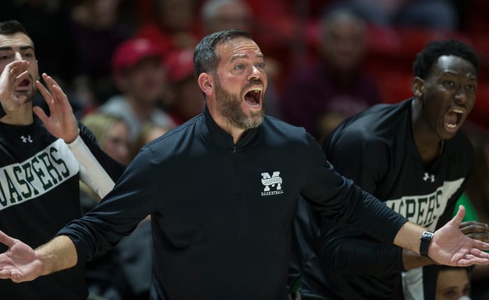 Manhattan men's basketball coach Steve Masiello questions a call during a game.