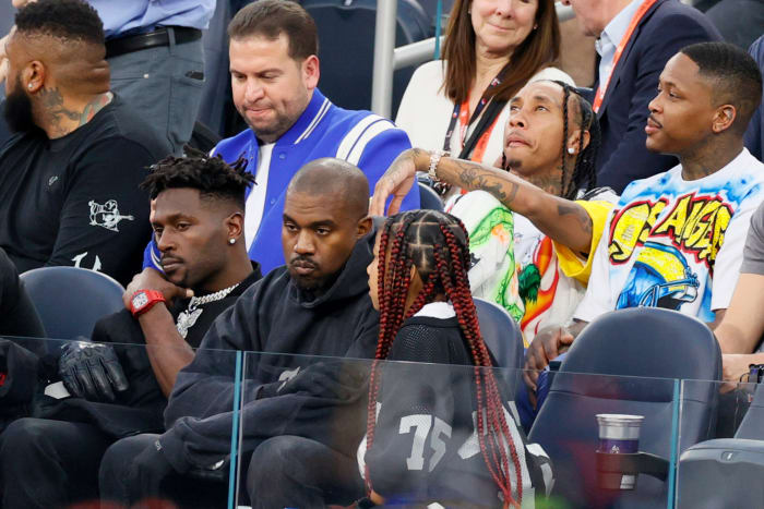 INGLEWOOD, CALIFORNIA - FEBRUARY 13: Antonio Brown, Kanye West and North West attend Super Bowl LVI between the Los Angeles Rams and the Cincinnati Bengals at SoFi Stadium on February 13, 2022 in Inglewood, California. (Photo by Steph Chambers/Getty Images)