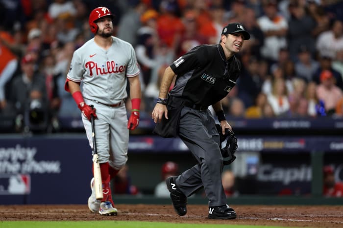 Umpire Pat Hoberg leans to watch a Kyle Schwarber fly ball in Game 2 of the 2022 World Series.