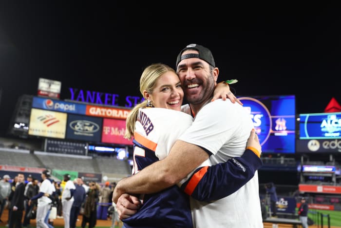 Kate Upton and Justin Verlander celebrating on the field.
