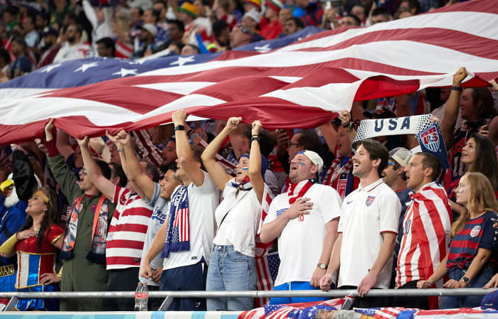 DOHA, QATAR - NOVEMBER 21: USA supporters sing their national anthem prior to the FIFA World Cup Qatar 2022 Group B match between USA and Wales at Ahmad Bin Ali Stadium on November 21, 2022 in Doha, Qatar. (Photo by Juan Luis Diaz/Quality Sport Images/Getty Images)