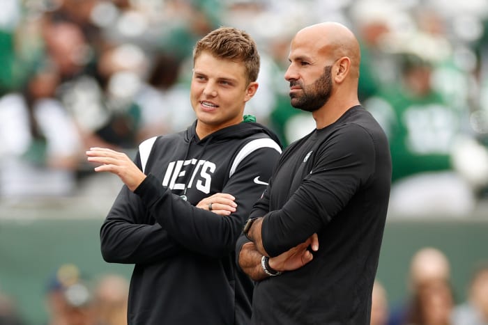 Zach Wilson and Robert Saleh talking.