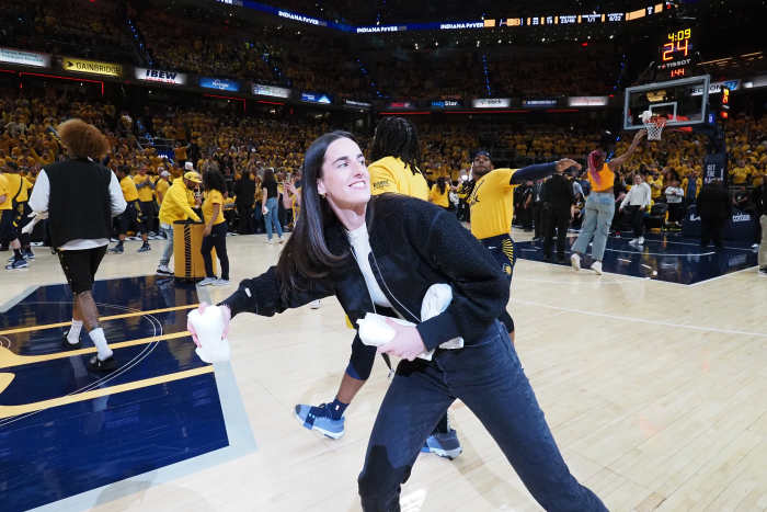 INDIANAPOLIS, IN - APRIL 26: Caitlin Clark #22 of the Indiana Fever throws out t-shirts during halftime of the game between the Milwaukee Bucks and the Indiana Pacers during Round 1 Game 3 of the 2024 NBA Playoffs on April 26, 2024 at Gainbridge Fieldhouse in Indianapolis, Indiana. NOTE TO USER: User expressly acknowledges and agrees that, by downloading and or using this Photograph, user is consenting to the terms and conditions of the Getty Images License Agreement. Mandatory Copyright Notice: Copyright 2024 NBAE (Photo by Ron Hoskins/NBAE via Getty Images)