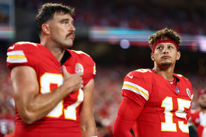 Chiefs on sideline for national anthem.