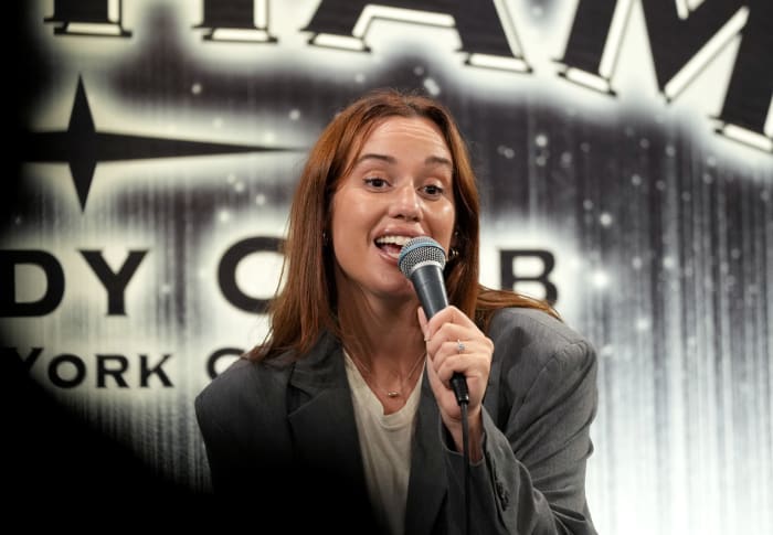 Hannah Berner tells joke at event.