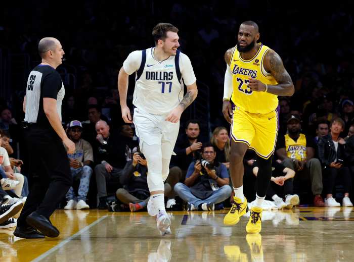 LOS ANGELES, CALIFORNIA - NOVEMBER 22: Luka Doncic #77 of the Dallas Mavericks reacts after scoring a basket against LeBron James #23 of the Los Angeles Lakers during the second half at Crypto.com Arena on November 22, 2023 in Los Angeles, California. NOTE TO USER: User expressly acknowledges and agrees that, by downloading and or using this photograph, User is consenting to the terms and conditions of the Getty Images License Agreement. (Photo by Kevork Djansezian/Getty Images)