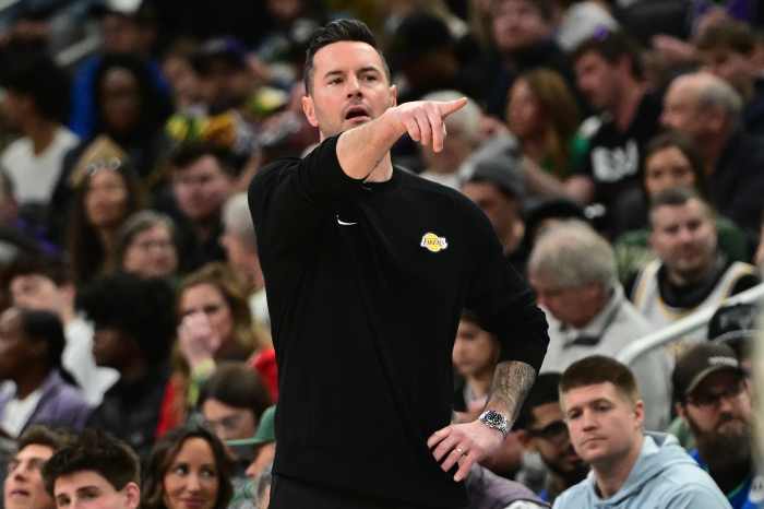 Los Angeles Lakers head coach JJ Redick calls a play in the third quarter against the Milwaukee Bucks at Fiserv Forum.