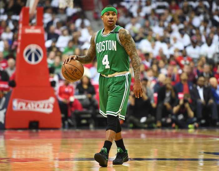 Boston Celtics guard Isaiah Thomas (4) dribbles the ball against the Washington Wizards.