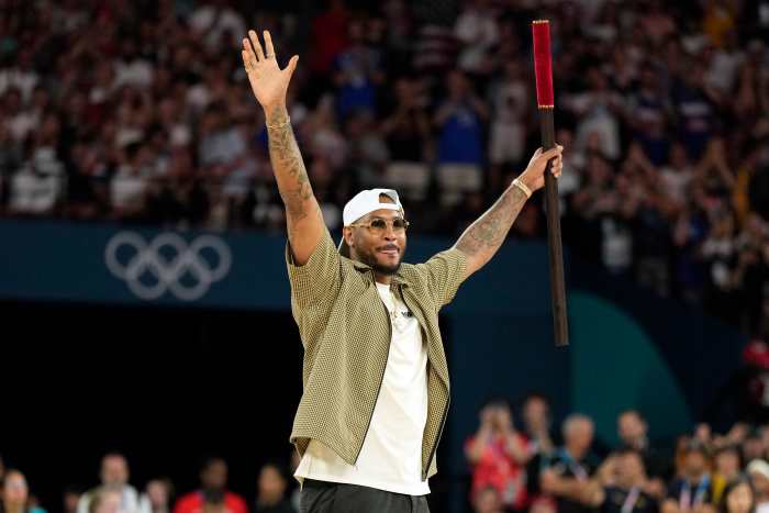 Carmelo Anthony performs before the quarterfinal clash between the United States and Brazil at the Paris Olympics.