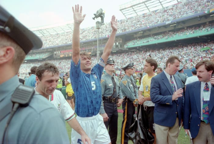 Paolo Maldini of Italy raises his hands in victory as he walks off the field after a World Cup soccer match between Italy and Bulgaria at Continental Airlines Arena in East Rutherford, N.J.