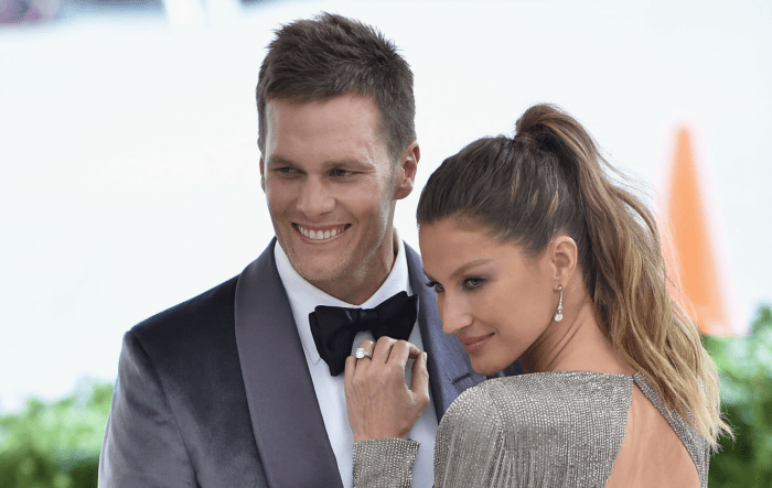 Tom Brady and his wife, Gisele, are on the red carpet for an event.