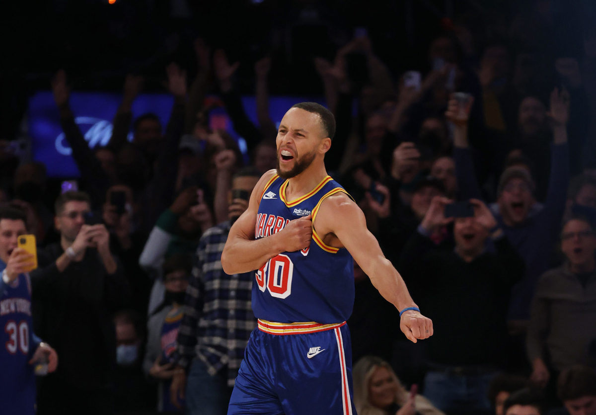 Golden State Warriors point guard Steph Curry celebrates his record setting three pointer.