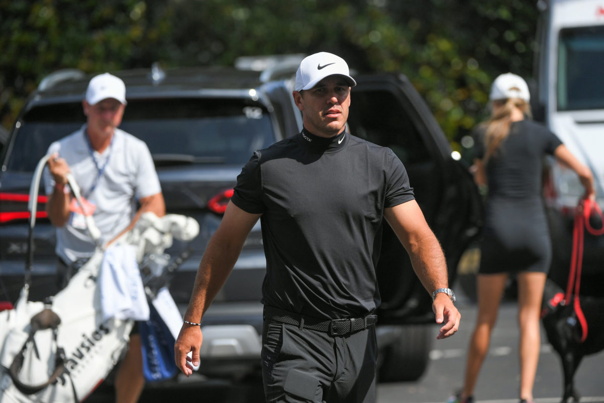 Brooks Koepka walks onto the course at the Tour Championship.