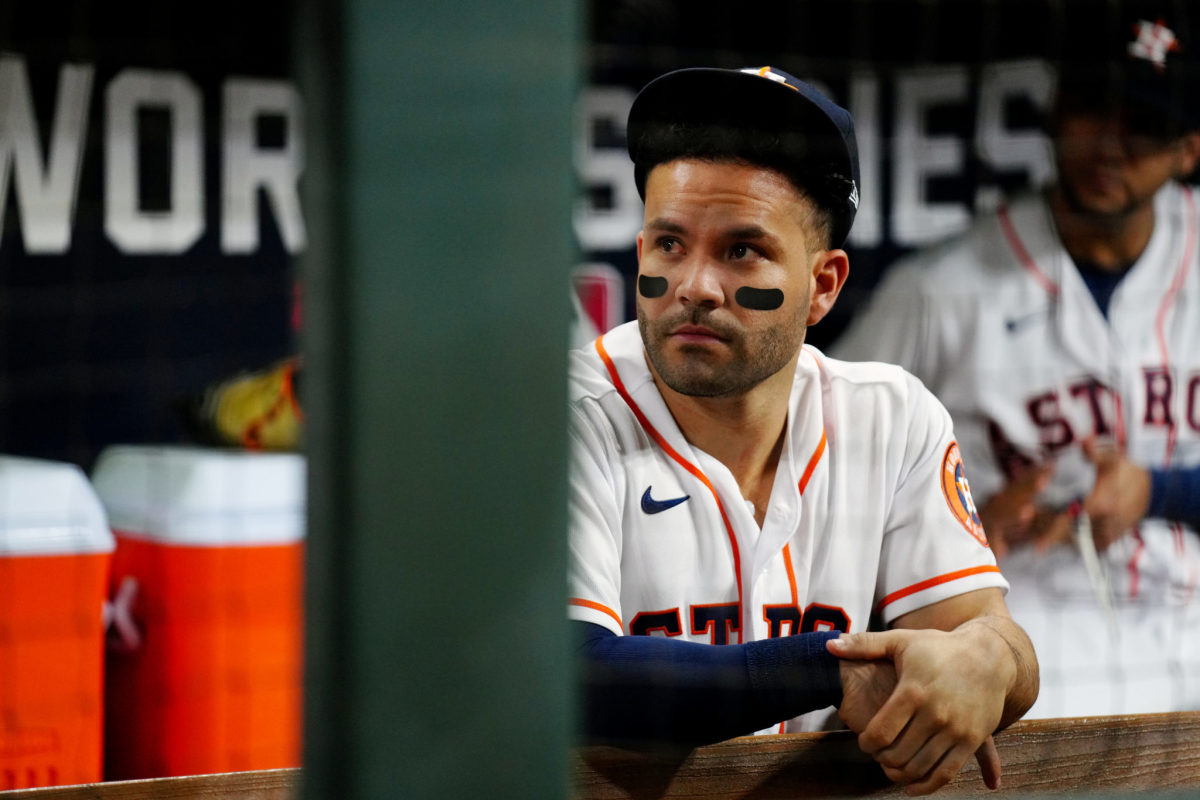 Jose Altuve sits in the Astros dugout.