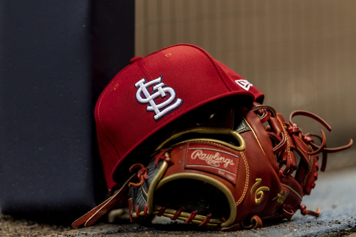 St. Louis Cardinals hat with a glove.